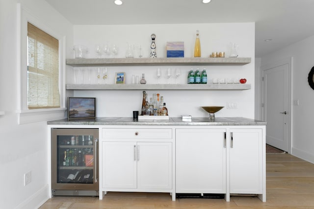 47 Pine Point Rd, Norwalk, CT 06853 - indoor dry bar with wine cooler, recessed lighting, and light wood-style flooring
