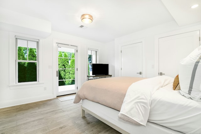 47 Pine Point Rd, Norwalk, CT 06853 - bedroom with access to exterior, light wood-style flooring, and recessed lighting