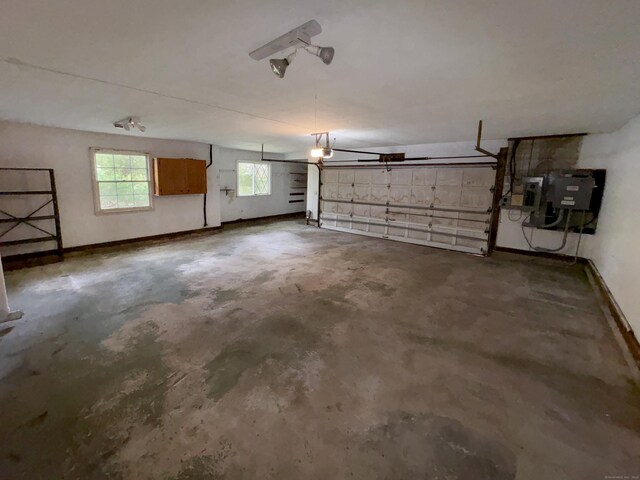206 Peddlers Rd, Guilford, CT 06437 - garage featuring baseboards and electric panel