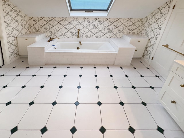 206 Peddlers Rd, Guilford, CT 06437 - bathroom featuring a garden tub, a skylight, vanity, and wallpapered walls
