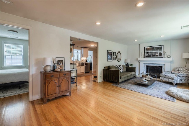60 Davenport Rd, West Hartford, CT 06110 - living room with light wood-style floors, a fireplace, and recessed lighting