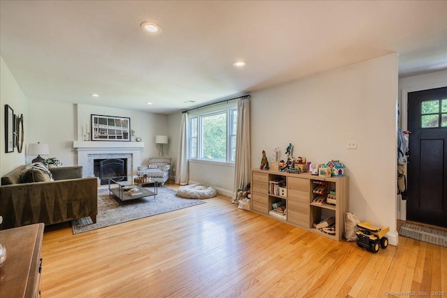 60 Davenport Rd, West Hartford, CT 06110 - living room with wood finished floors, a glass covered fireplace, and recessed lighting