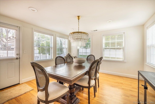 60 Davenport Rd, West Hartford, CT 06110 - dining area with a chandelier, healthy amount of natural light, and light wood-style flooring