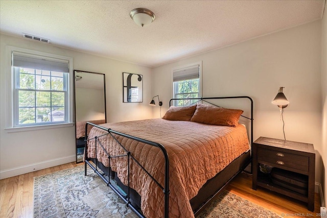 60 Davenport Rd, West Hartford, CT 06110 - bedroom with wood finished floors and a textured ceiling