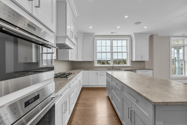 66 High St Unit 36, Guilford, CT 06437 - kitchen with recessed lighting, light countertops, tasteful backsplash, white cabinetry, and appliances with stainless steel finishes