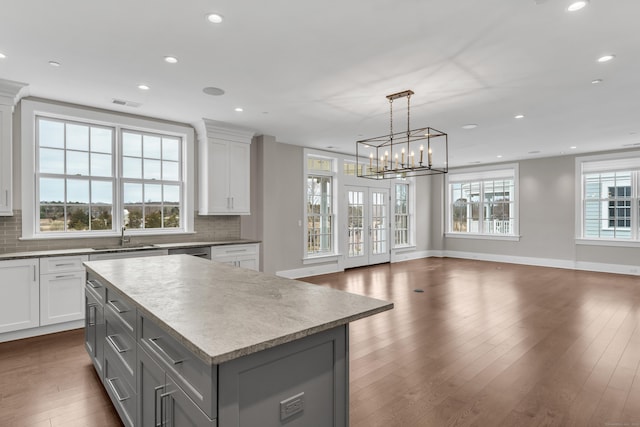 66 High St Unit 36, Guilford, CT 06437 - kitchen featuring gray cabinetry, recessed lighting, a sink, open floor plan, and backsplash