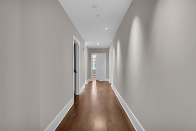 66 High St Unit 36, Guilford, CT 06437 - corridor featuring dark wood finished floors, baseboards, and recessed lighting