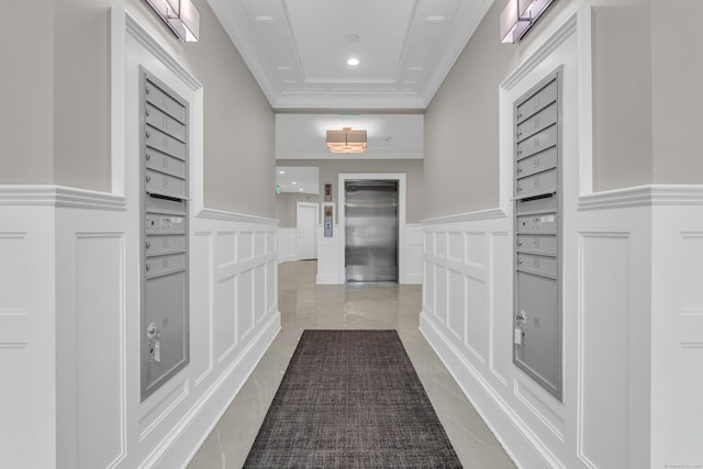 66 High St Unit 36, Guilford, CT 06437 - hall with elevator, crown molding, wainscoting, a decorative wall, and light marble finish floors