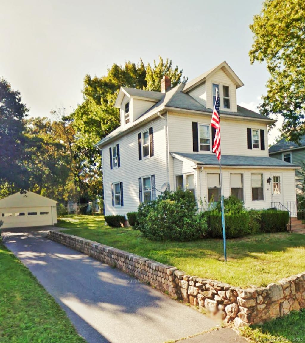 46 Glenwood St, Manchester, CT 06040 - view of front of home with an outdoor structure, a chimney, a garage, and a front yard