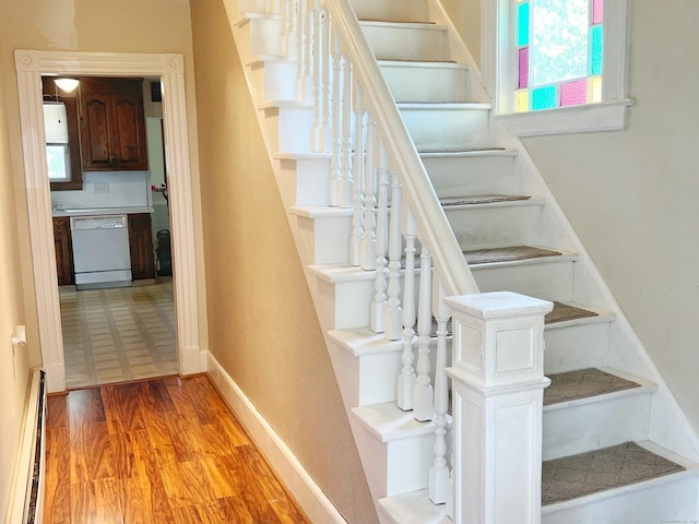 46 Glenwood St, Manchester, CT 06040 - staircase with a baseboard heating unit, healthy amount of natural light, and wood finished floors