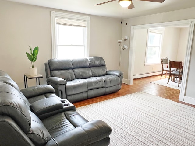 46 Glenwood St, Manchester, CT 06040 - living room with a baseboard radiator, a ceiling fan, light wood-style flooring, and plenty of natural light
