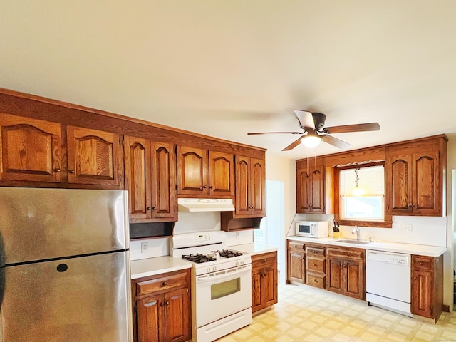 46 Glenwood St, Manchester, CT 06040 - kitchen with white appliances, under cabinet range hood, light countertops, a ceiling fan, and light flooring