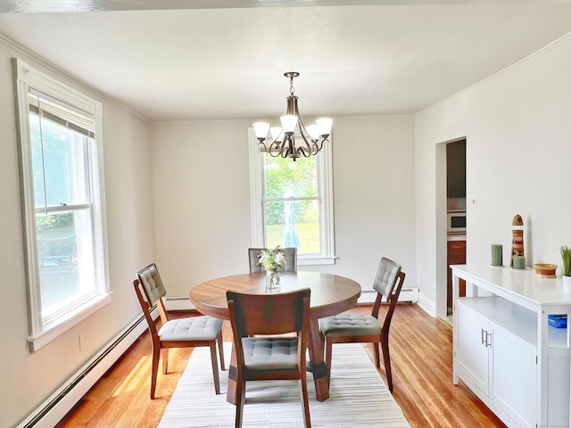 46 Glenwood St, Manchester, CT 06040 - dining room with a baseboard radiator, light wood-type flooring, and healthy amount of natural light