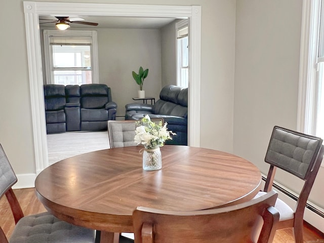 46 Glenwood St, Manchester, CT 06040 - dining space with plenty of natural light, a ceiling fan, wood finished floors, and a baseboard radiator