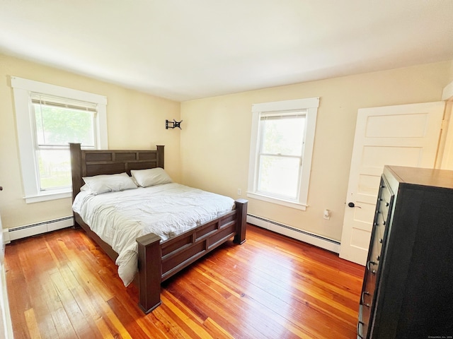 46 Glenwood St, Manchester, CT 06040 - bedroom with a baseboard heating unit and light wood-type flooring