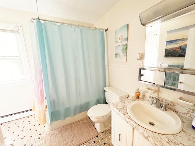 46 Glenwood St, Manchester, CT 06040 - full bathroom featuring vanity, tile walls, shower / tub combo, and a baseboard radiator
