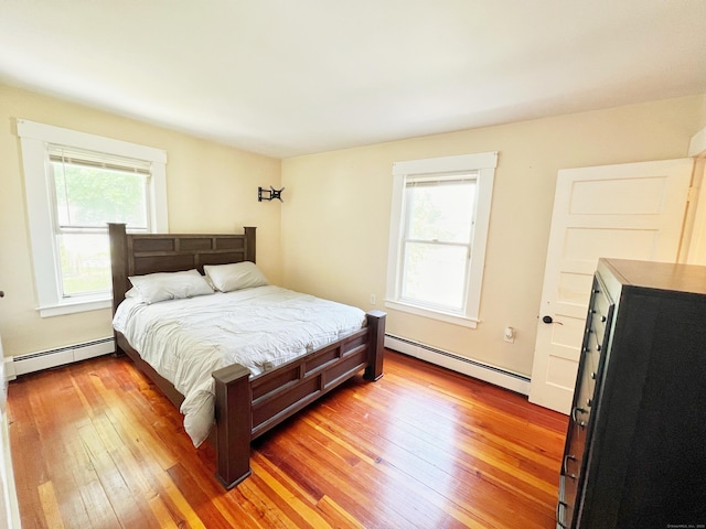 46 Glenwood St, Manchester, CT 06040 - bedroom with baseboard heating and light wood-style flooring