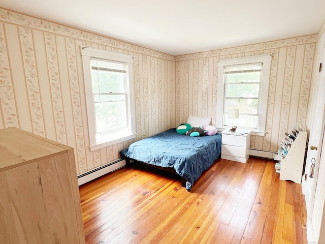 46 Glenwood St, Manchester, CT 06040 - bedroom featuring a baseboard heating unit, light wood-type flooring, and wallpapered walls