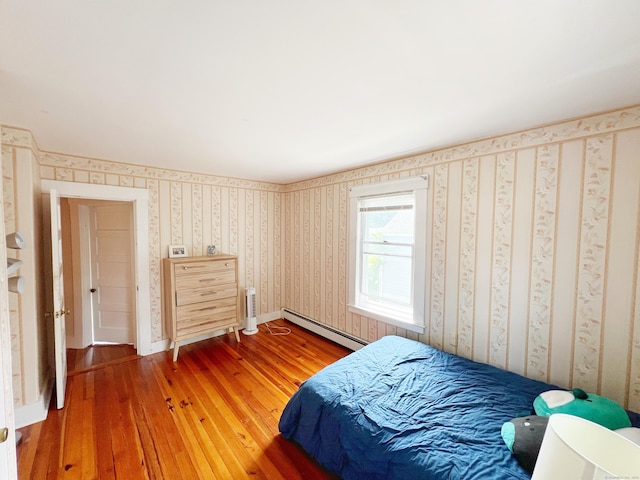 46 Glenwood St, Manchester, CT 06040 - bedroom featuring a baseboard heating unit, light wood-style floors, and wallpapered walls
