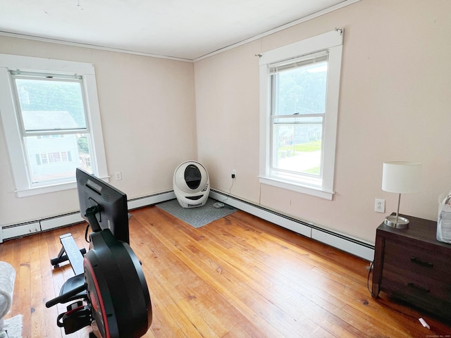 46 Glenwood St, Manchester, CT 06040 - exercise area featuring crown molding, light wood-style floors, and a baseboard radiator