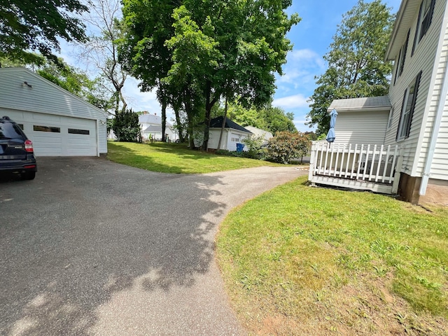 46 Glenwood St, Manchester, CT 06040 - view of grassy yard featuring an outbuilding and a garage