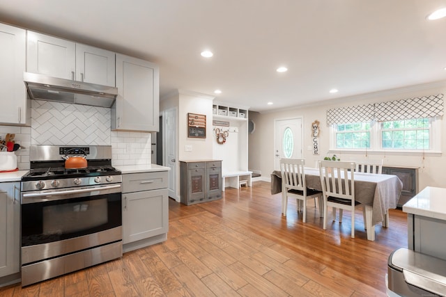 28 Hope Hill Rd, Wallingford, CT 06492 - kitchen with stainless steel range with gas stovetop, gray cabinetry, under cabinet range hood, light countertops, and ornamental molding