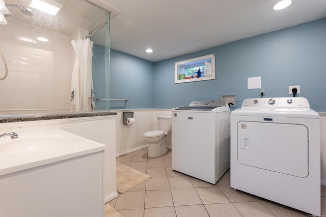 28 Hope Hill Rd, Wallingford, CT 06492 - laundry area featuring washing machine and dryer, a wainscoted wall, light tile patterned flooring, and recessed lighting