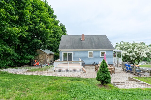 28 Hope Hill Rd, Wallingford, CT 06492 - back of house with a deck, a yard, a storage shed, and a chimney