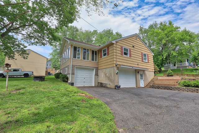 19 Benedict St, Plymouth, CT 06786 - view of home's exterior featuring driveway, an attached garage, and a lawn