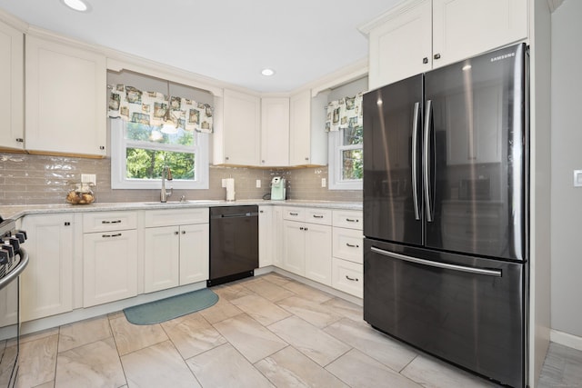 19 Benedict St, Plymouth, CT 06786 - kitchen featuring freestanding refrigerator, dishwashing machine, plenty of natural light, backsplash, and recessed lighting