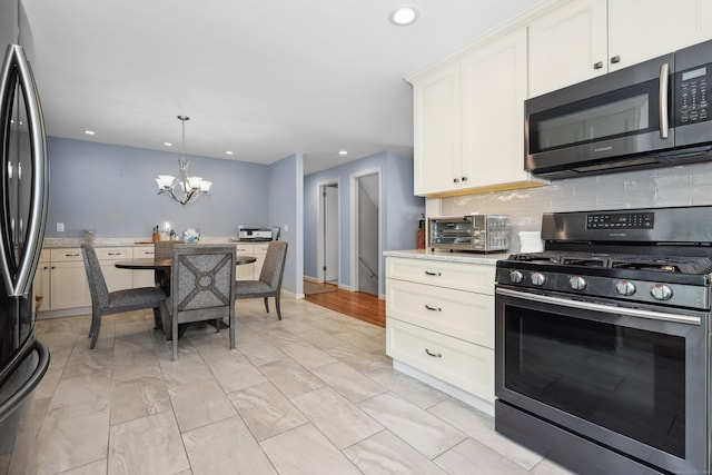 19 Benedict St, Plymouth, CT 06786 - kitchen featuring stainless steel appliances, a chandelier, tasteful backsplash, recessed lighting, and pendant lighting