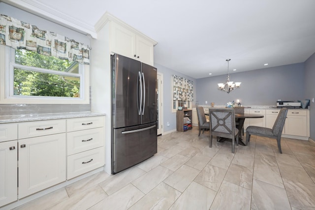 19 Benedict St, Plymouth, CT 06786 - kitchen with freestanding refrigerator, a chandelier, white cabinets, light stone countertops, and recessed lighting