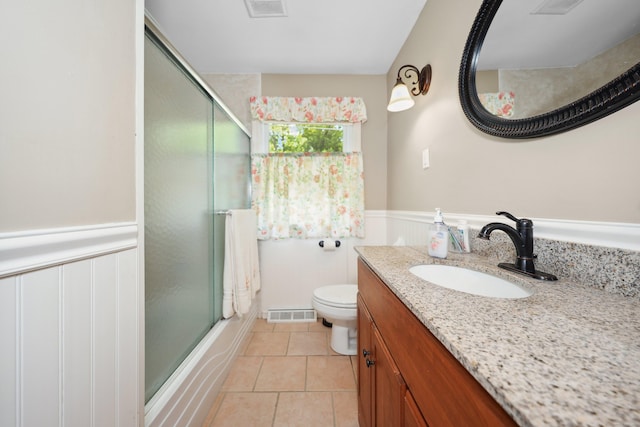 19 Benedict St, Plymouth, CT 06786 - full bath featuring vanity, wainscoting, tile patterned floors, and bath / shower combo with glass door