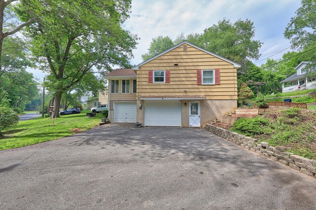 19 Benedict St, Plymouth, CT 06786 - view of property exterior featuring asphalt driveway and a garage