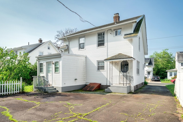 43 Quentin St, Hamden, CT 06517 - rear view of property with a chimney and a shingled roof