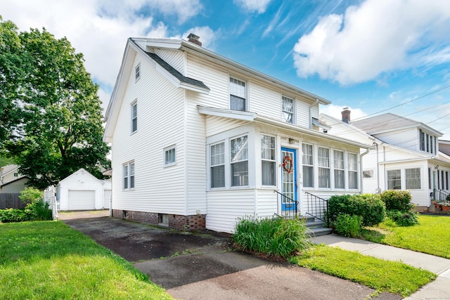 43 Quentin St, Hamden, CT 06517 - traditional-style house featuring a chimney, driveway, an outdoor structure, a detached garage, and a front yard