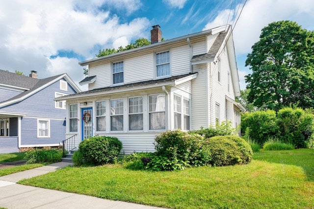 43 Quentin St, Hamden, CT 06517 - view of front facade featuring a front yard and a chimney