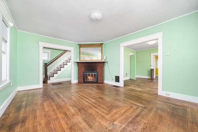 43 Quentin St, Hamden, CT 06517 - unfurnished living room with crown molding, a fireplace, and stairway