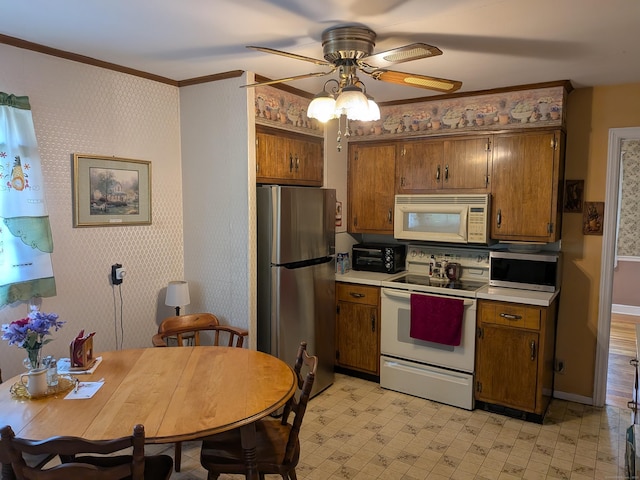35 Chevvy St, Stratford, CT 06614 - kitchen featuring appliances with stainless steel finishes, a ceiling fan, light countertops, brown cabinets, and ornamental molding