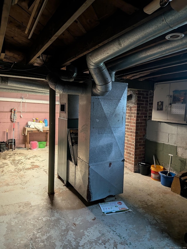 35 Chevvy St, Stratford, CT 06614 - unfinished below grade area featuring heating unit and concrete block wall