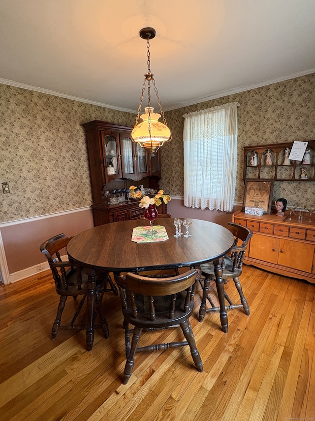 35 Chevvy St, Stratford, CT 06614 - dining area featuring wallpapered walls, light wood-style flooring, and ornamental molding