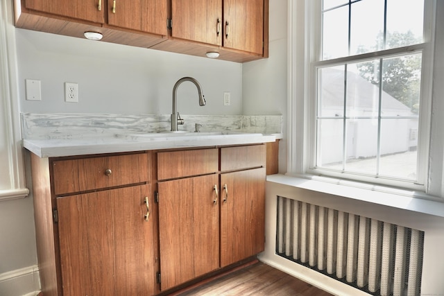 575 S Main St, Naugatuck, CT 06770 - bar area featuring radiator heating unit and wood finished floors