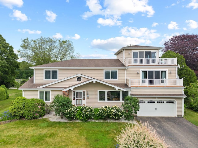 224 Neptune Dr, Groton, CT 06340 - view of front of property featuring a balcony, an attached garage, asphalt driveway, a front lawn, and roof with shingles