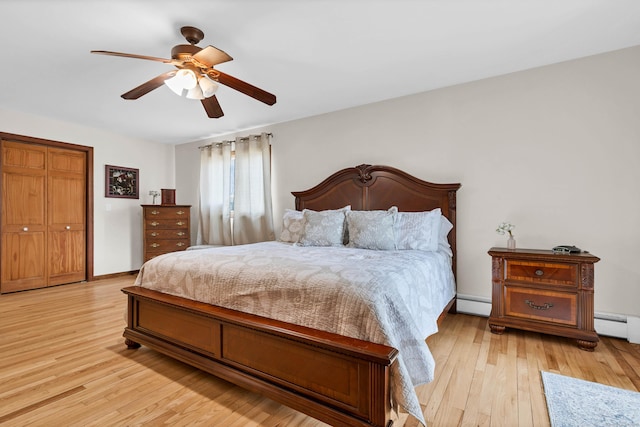 224 Neptune Dr, Groton, CT 06340 - bedroom with light wood-style floors, a baseboard heating unit, baseboards, baseboard heating, and ceiling fan