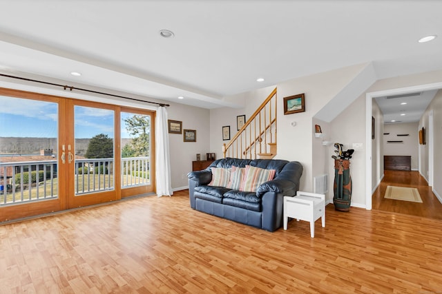 224 Neptune Dr, Groton, CT 06340 - living room with light wood finished floors, stairs, baseboards, and recessed lighting