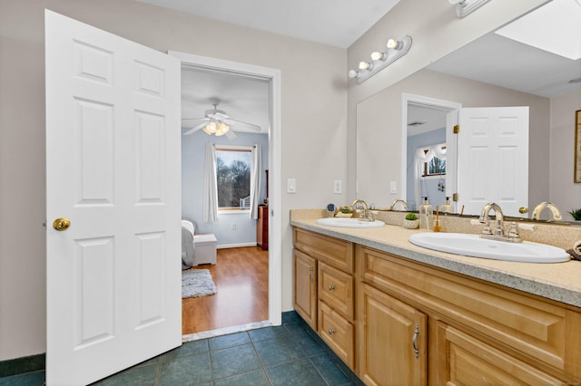224 Neptune Dr, Groton, CT 06340 - full bathroom featuring double vanity, tile patterned floors, a ceiling fan, and baseboards