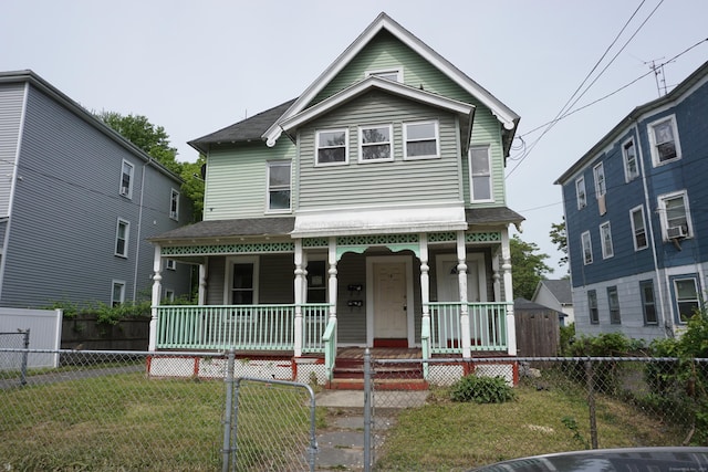 71 Martin St, Hartford, CT 06120 - view of front of property with a porch, a fenced front yard, and cooling unit
