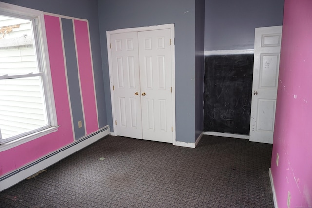 71 Martin St, Hartford, CT 06120 - unfurnished bedroom featuring a baseboard heating unit, carpet floors, and a closet