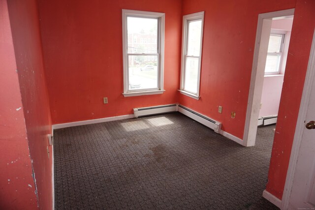 71 Martin St, Hartford, CT 06120 - carpeted empty room featuring healthy amount of natural light and a baseboard radiator