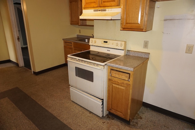 71 Martin St, Hartford, CT 06120 - kitchen featuring electric stove, under cabinet range hood, and brown cabinets